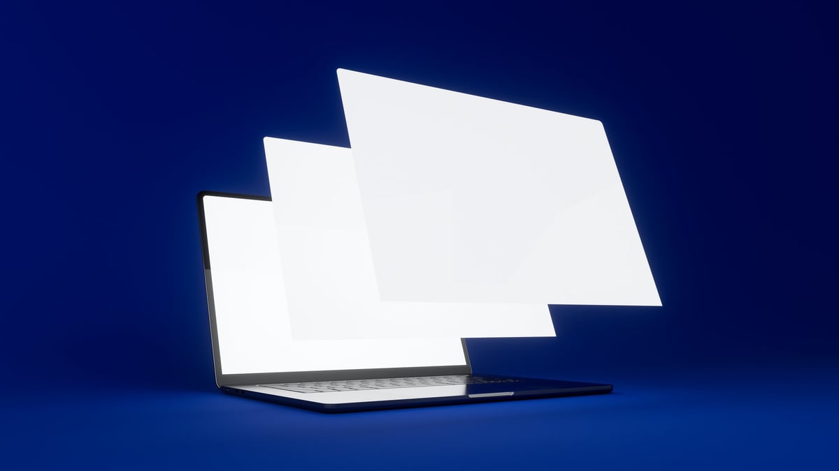Professional web design workspace with floating screens